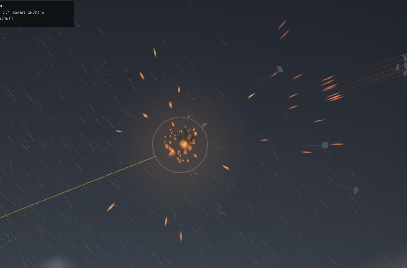 A chip-fused round bursting in mid-air, fragments flying out